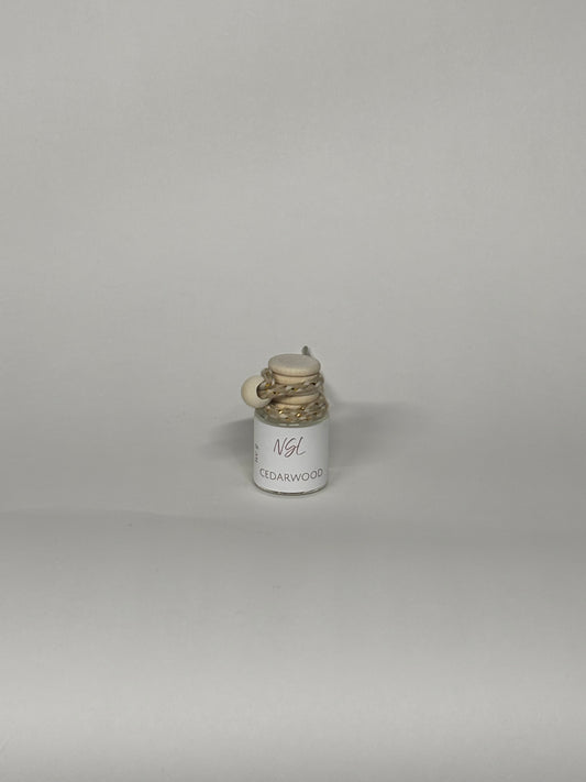 cedarwood hanging diffuser on a white background