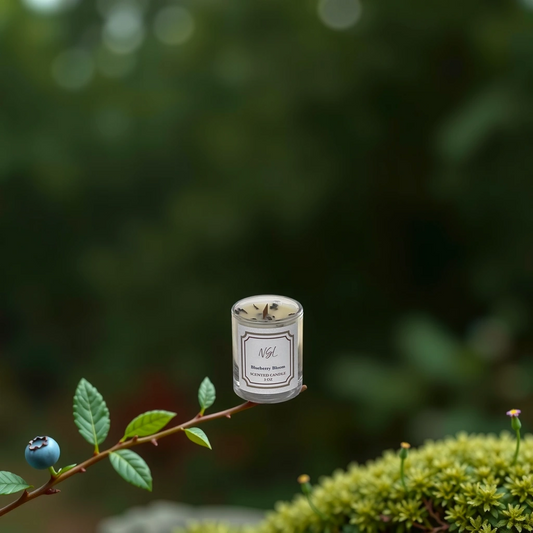 3oz wood wick blueberry bloom candle in a forest background