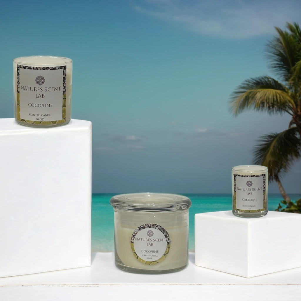 3oz, 10oz and 15oz coco/lime candles on a white platform in front of a tropical background